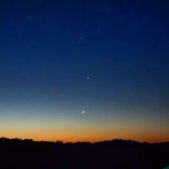 Jupiter and venus dancing in night sky